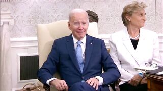 Biden sits quietly, looks confused as reporters ask questions