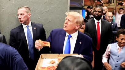 Video shows crowd loving Trump, sharing some fresh hot pizza