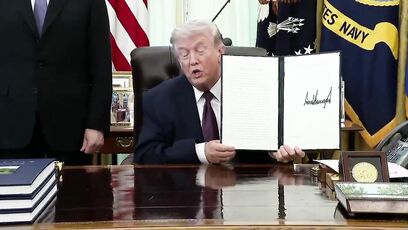 Trump uses a REAL PEN to sign a landmark Executive Order