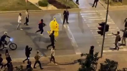 Pikachu runs from the cops at protest