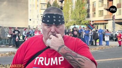 Anti-ICE protester rubs pepper ball residue in his gum to show off