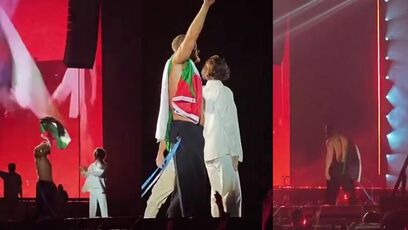 Imagine Dragons ends by waving Palestinian flag