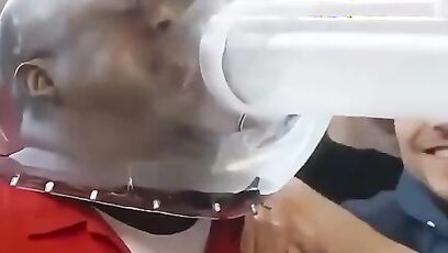 Guys try to blow spiders into each other's mouth