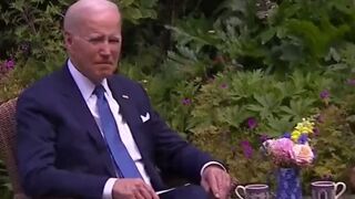Joe Biden looks lost and confused while sipping tea