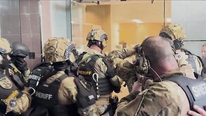 SWAT sniper eliminates bank robber, saves hostages