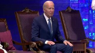 Biden sits in a trance as people begin standing up