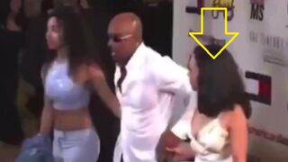 Montel Williams holding hands with Kamala Harris and another woman (his daughter)