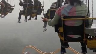 Riders stuck HIGH above a roller coaster during storm at Six Flags