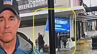 Reporter covers camera when Trump flag goes by