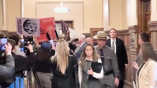 Tom Homan waves to protesters invading the NY State Capitol