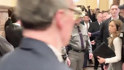 Tom Homan waves to protesters invading the NY State Capitol