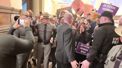 Tom Homan waves to protesters invading the NY State Capitol