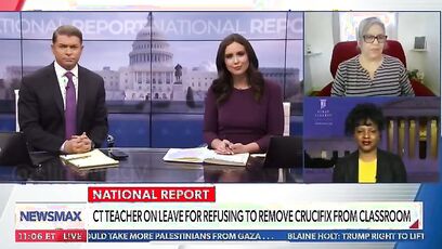 Teacher suspended for refusing to remove crucifix files lawsuit