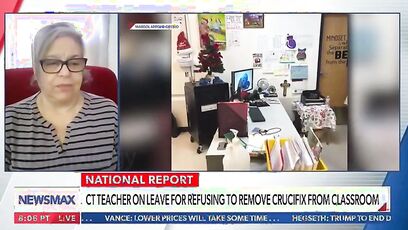 Teacher suspended for refusing to remove crucifix files lawsuit