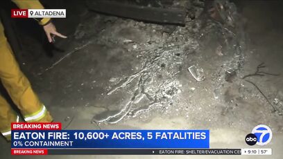 Reporter shows car where metal has melted along the ground