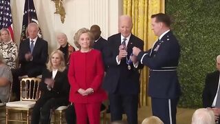 Biden gives Hillary Clinton award, appears to kiss her at end