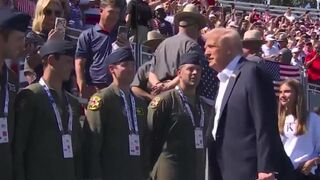 Golf crowd erupts in "USA" chants as Trump and his granddaughter Kai arrive at the Ryder Cup