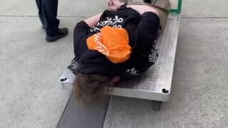 ICE wheels protester away on a flatbed