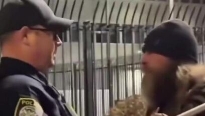 Federal agents KICK OVER a memorial for the woman who tried to run over an agent