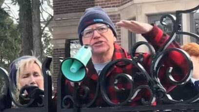 Tim Walz climbing on the gate of his mansion inciting violence against ICE