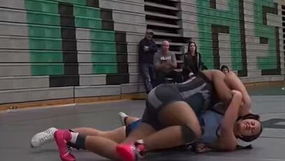 Female wrestler touched inappropriately by male wrestler