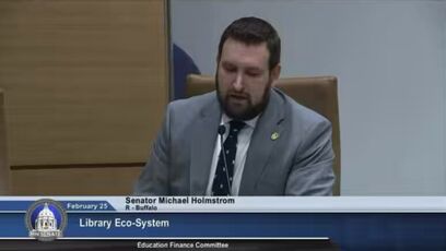 Sen. Holmstrom is told to stop reading inappropriate book that's available to kids