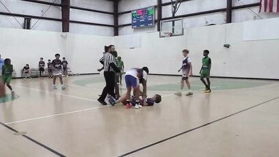 Thug attacks someone during basketball game