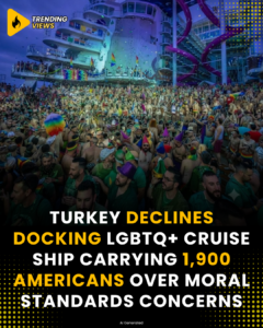 Crowd of passengers in colorful attire and rainbow accessories on the deck of a large cruise ship